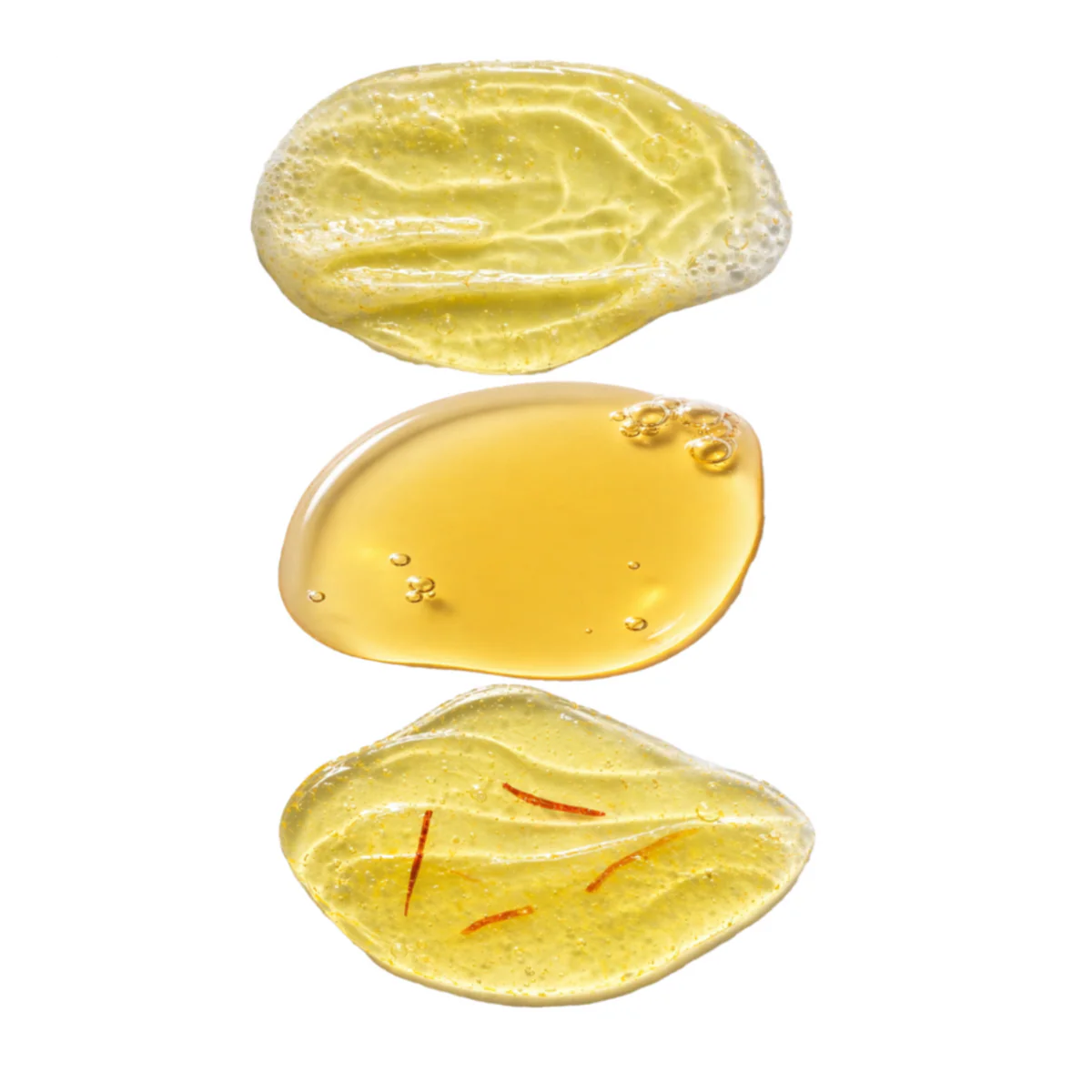 Serene Saffron Suite skincare textures featuring Velvet Virtuoso Facial Cleanser foam, Celestial Saffron Elixir serum and Krocus Kiss Radiance Face Gel infused with saffron strands for hydration and radiance